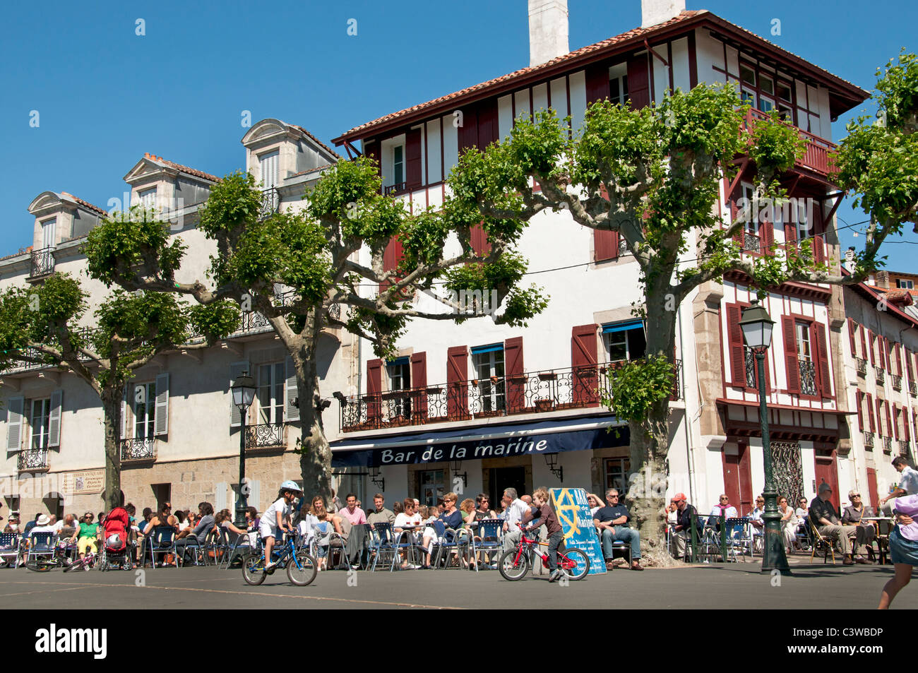 Place Loui XIV France St Jean de Luz Restaurant Bar Pub Pavement a typical fishing village Stock Photo