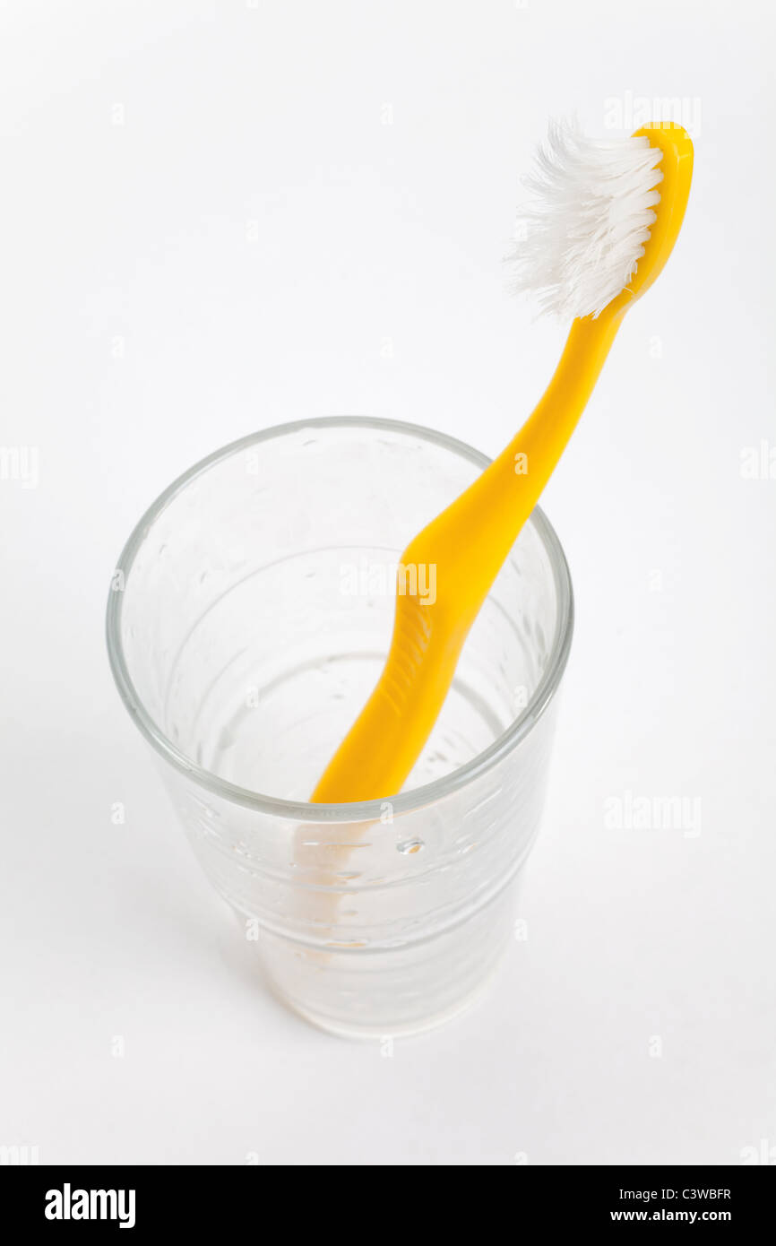 Toothbrush and glass close up shot Stock Photo