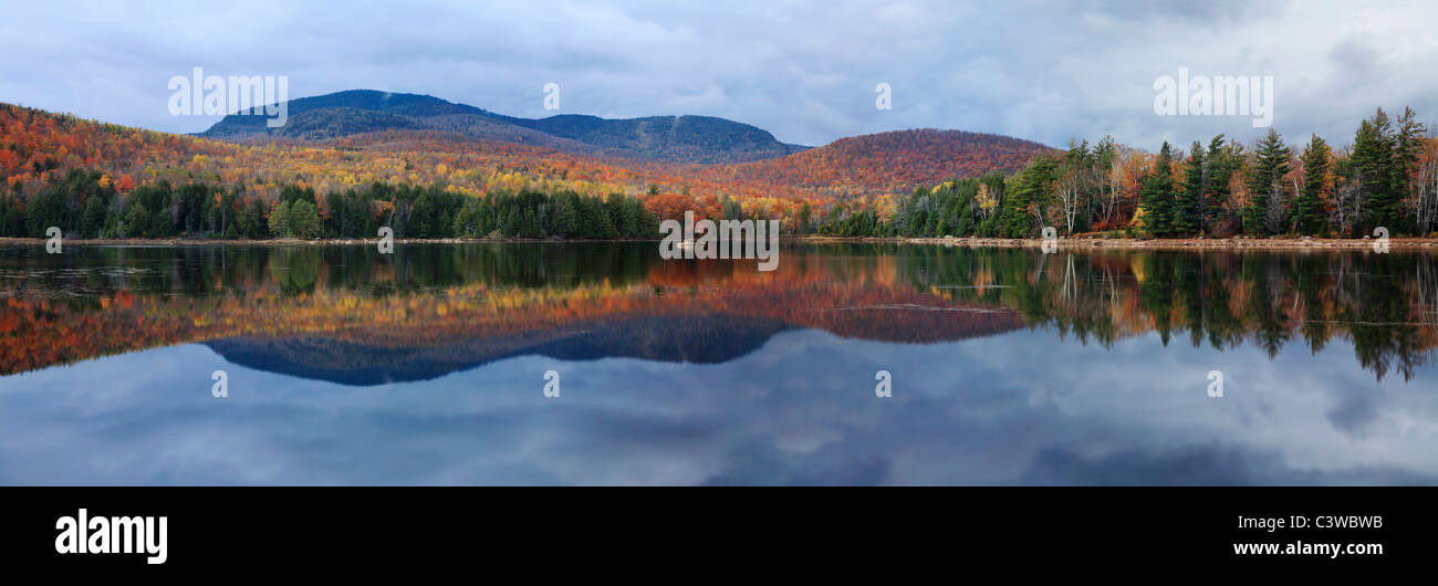 A Clear Colorful Reflection On An Autumn Evening At Loon Lake In The