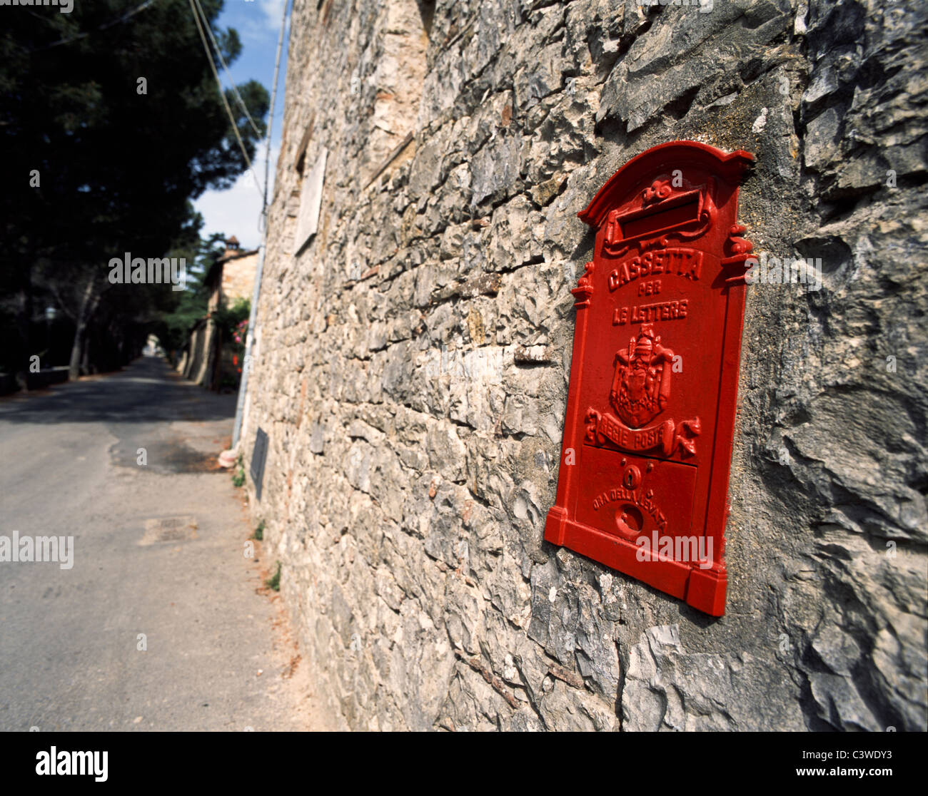 Ancient red Italian postbox in a gray stonewall of a house in Gaiole in Chianti 'Europe's Most Idyllic Place to Live.', Tuscany Stock Photo