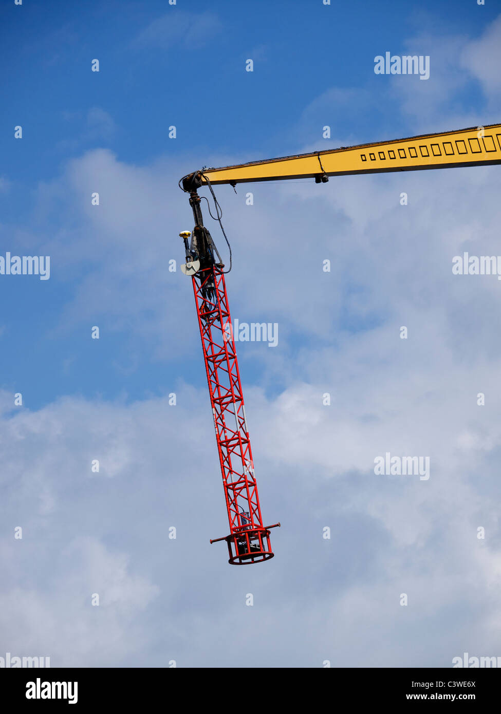 Measuring probe on crane, used to exactly measure the position of concrete blocks up to 50m away from the shore. Rotterdam Stock Photo