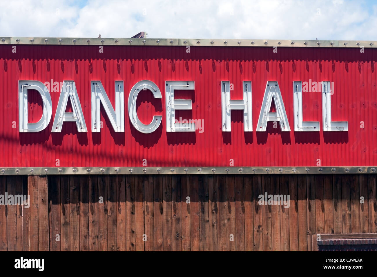 dance hall ballroom red lights dancing sign barn saloon bar Stock Photo