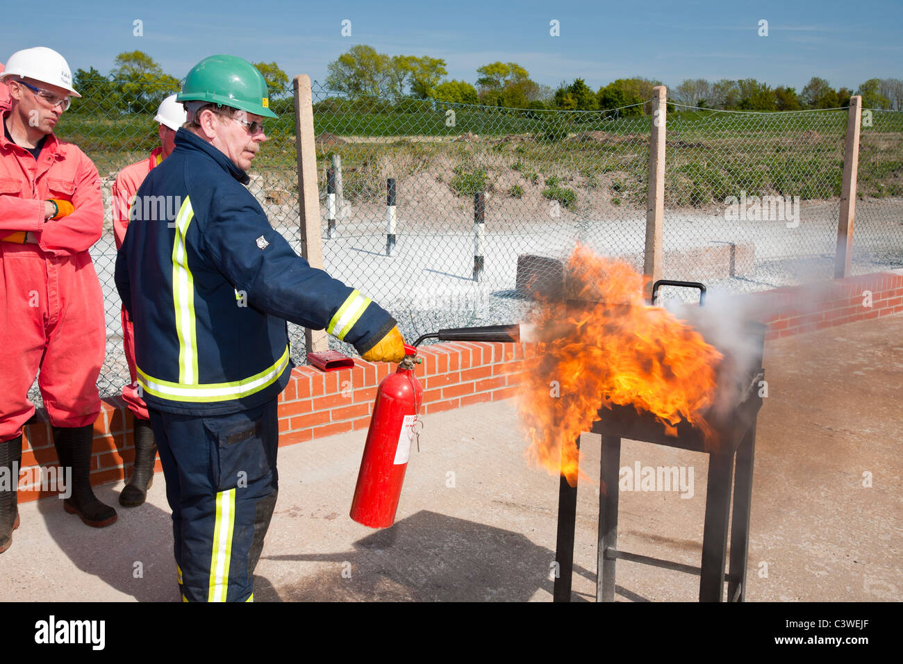 Workers in the offshore industry practice fire fighting as part of an