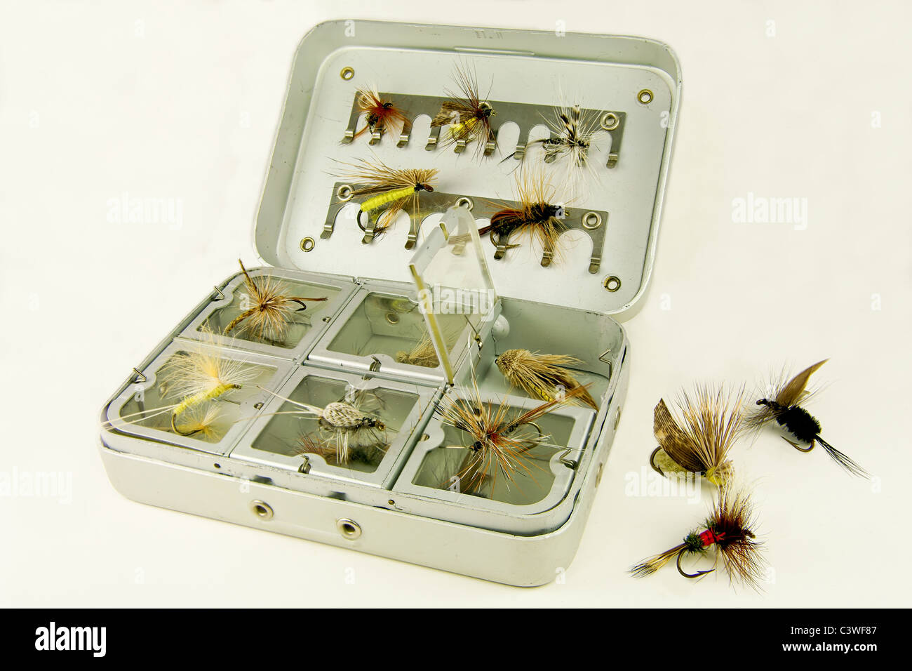 Fly Fishing Box: A well-used tackle box displays a variety of handmade lures  for fly-fishing Stock Photo - Alamy