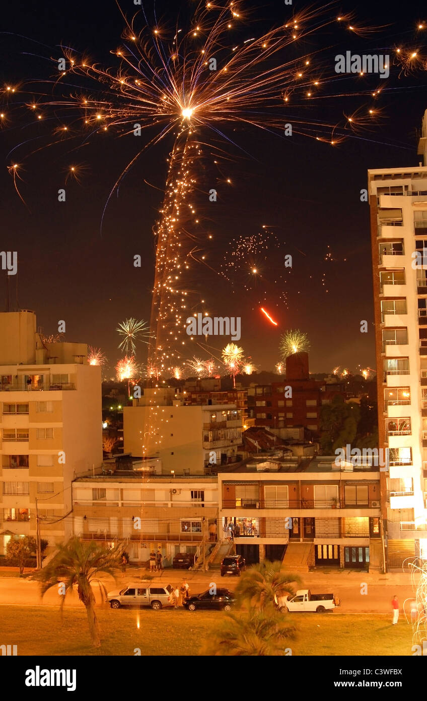 Night scene of Christmas fireworks celebration over the buildings