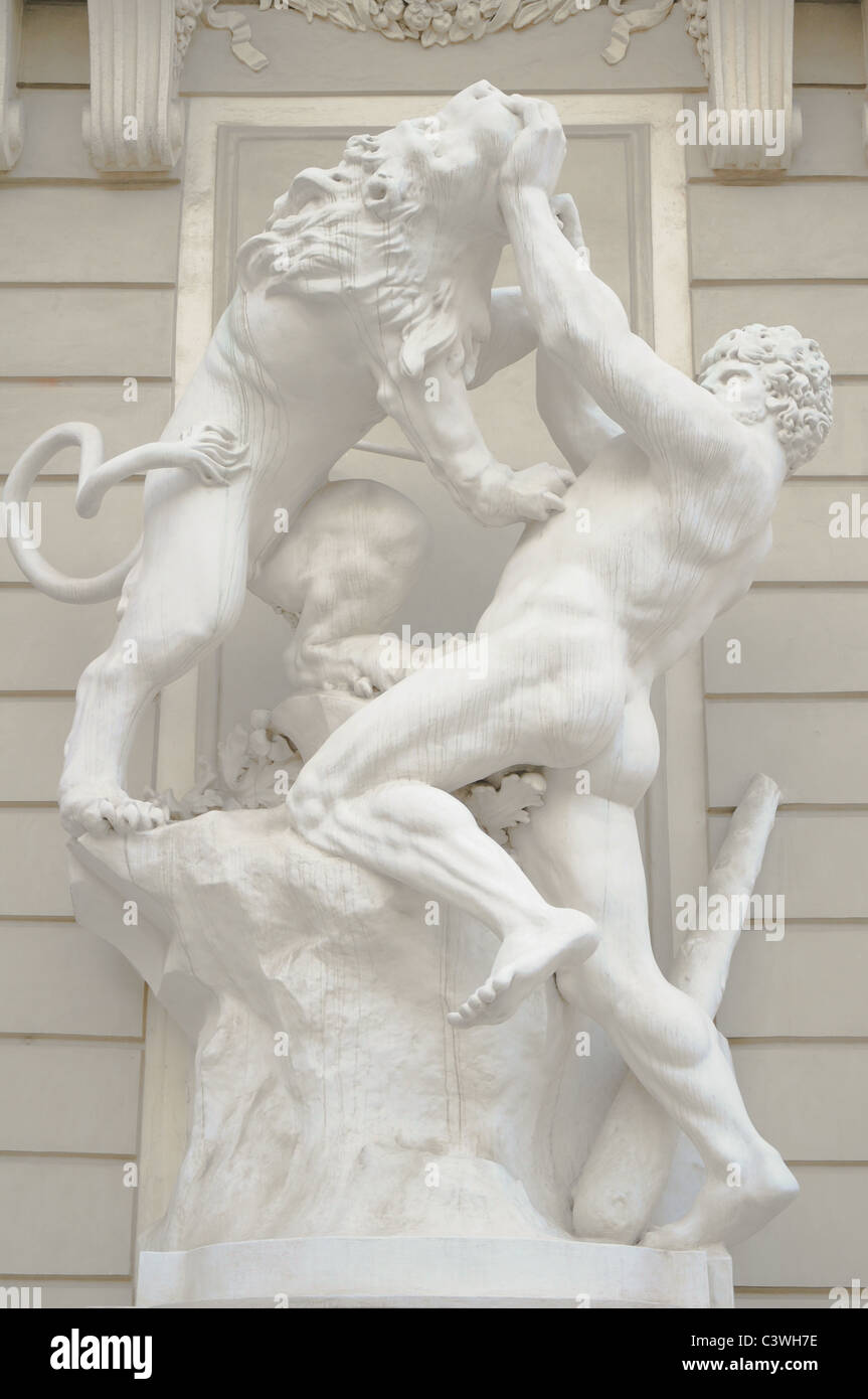 antique statue of a greek male god wrestling a lion Stock Photo - Alamy