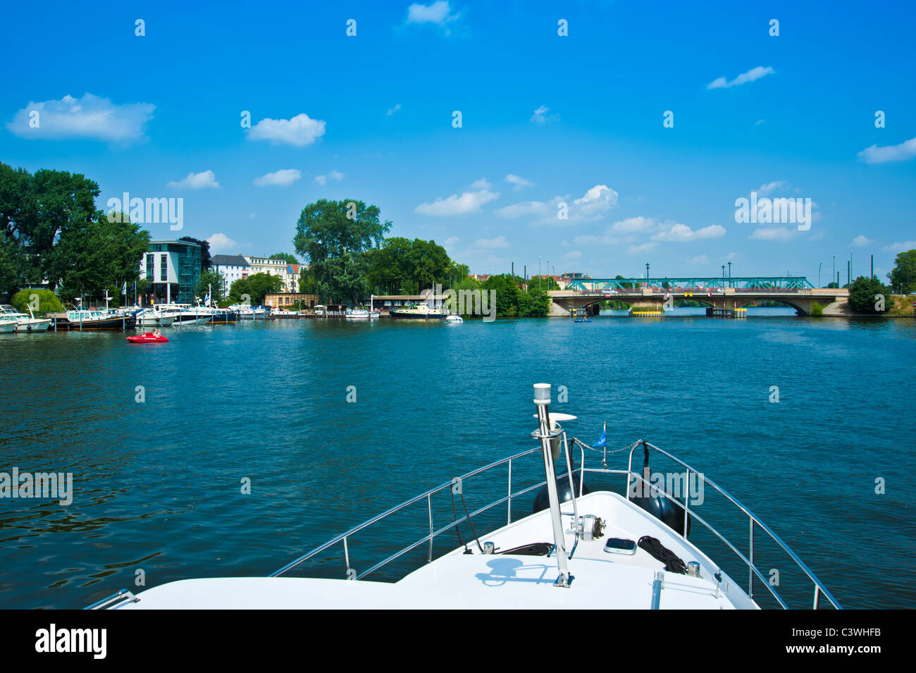 Bow of yacht approaching bridge on river Spree, Berlin, Germany Stock Photo