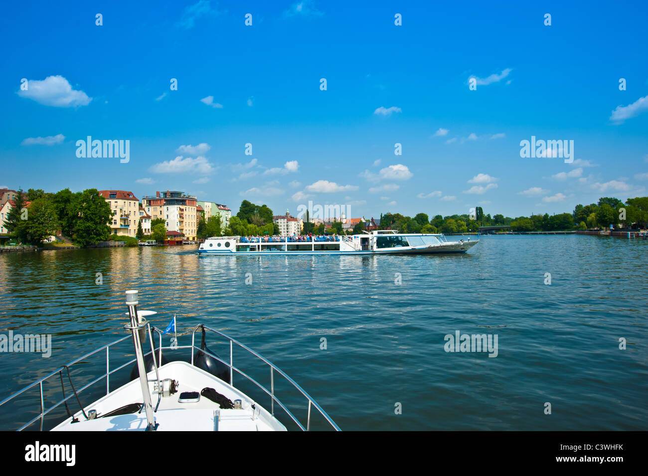 Bow of yacht and tourist boat on river Spree, Berlin, Germany Stock Photo