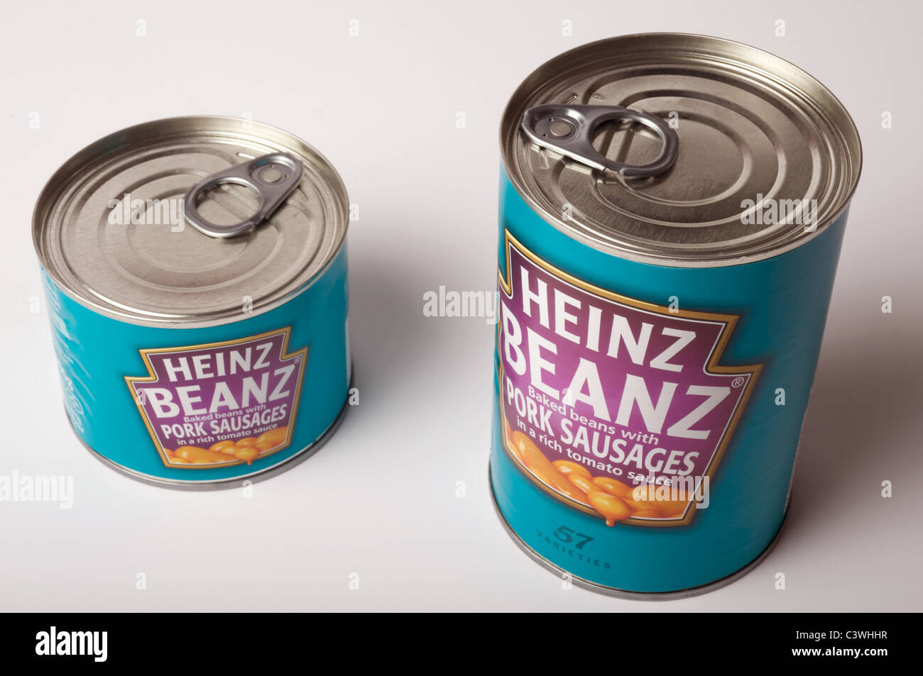 Large and small cans of Heinz baked beans Stock Photo