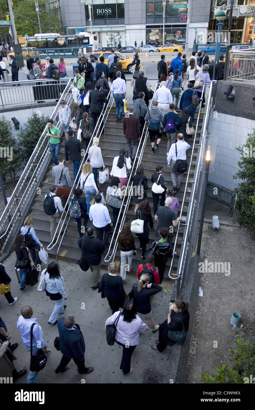 Subway riders enter and exit the Columbus Circle Subway Station at the southwest corner of Central Park in New York City. Stock Photo