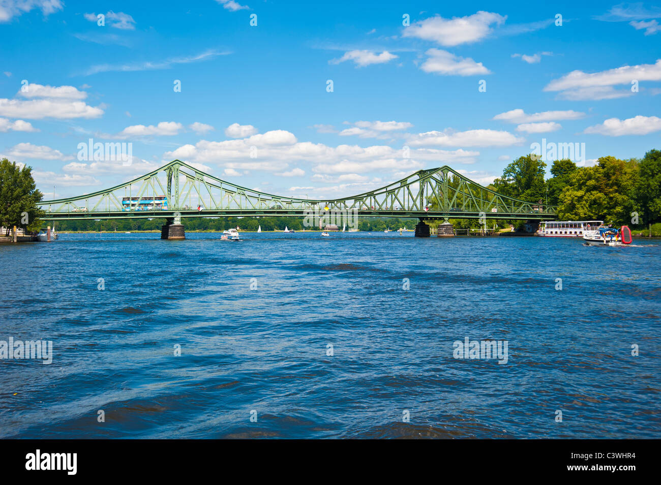Tourist boat waiting at Glienicker Bridge over Havel, Potsdam, Berlin, Brandenburg, Germany Stock Photo