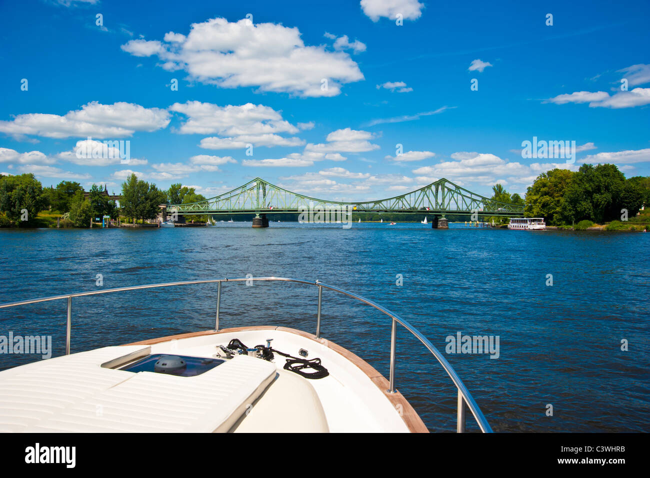 Bow of boat or yacht in front of Glienicker Bridge over Havel, Potsdam, Berlin, Brandenburg, Germany Stock Photo