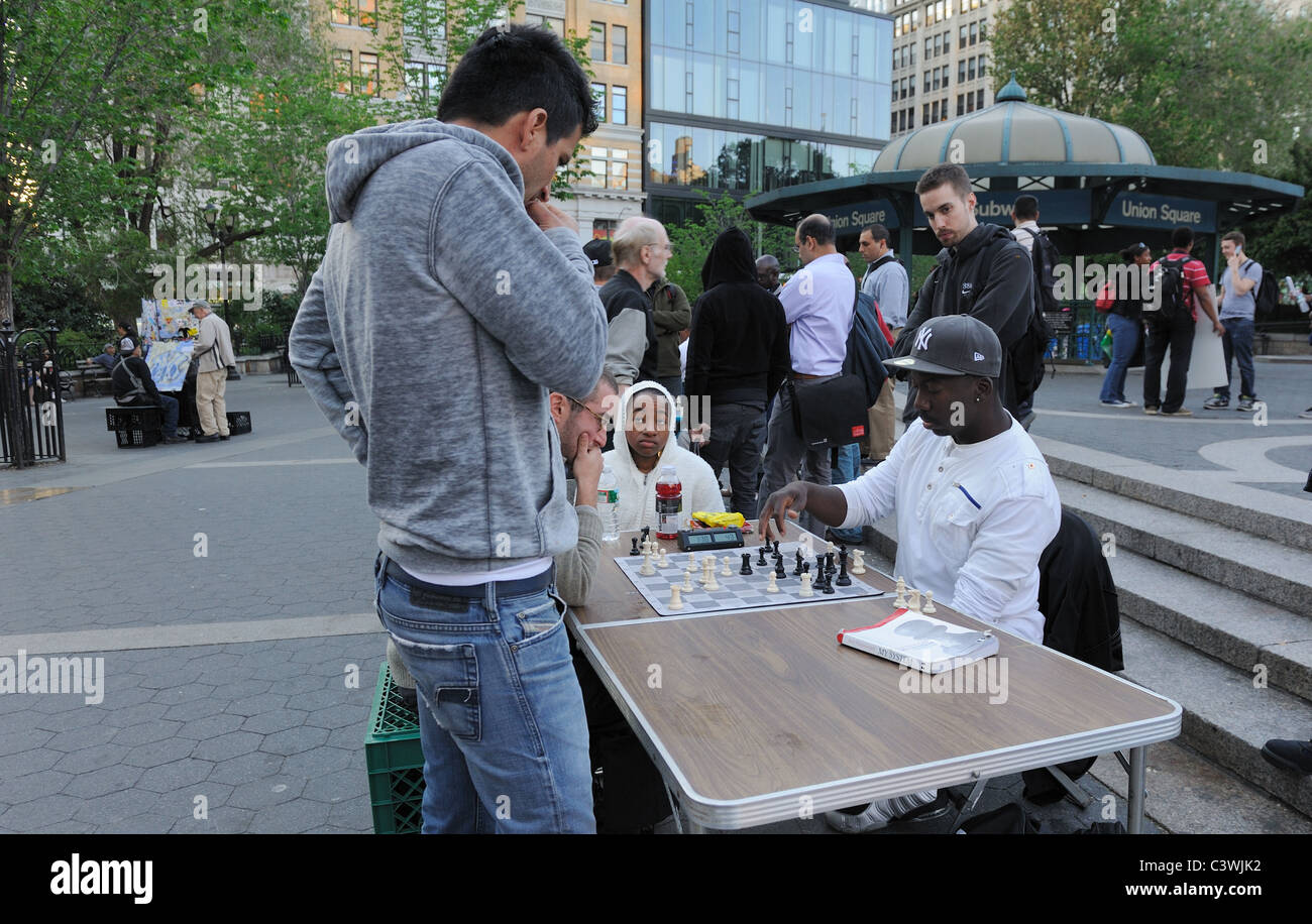 A chess game in Manhattan's Union Square Park. May 9, 2011 Stock Photo