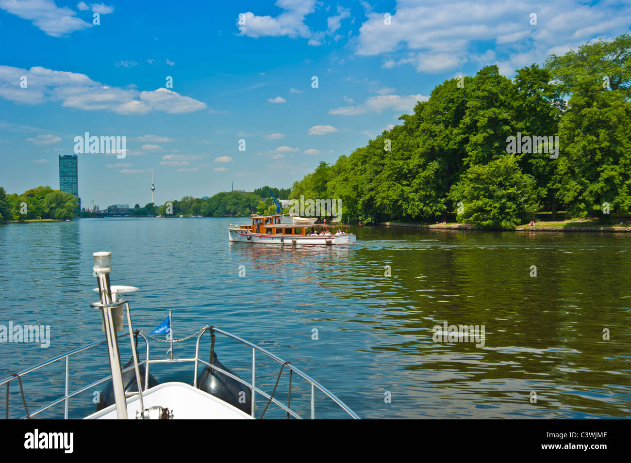 Bow of yacht and wooden tourist boat on river Spree, Berlin, Germany Stock Photo