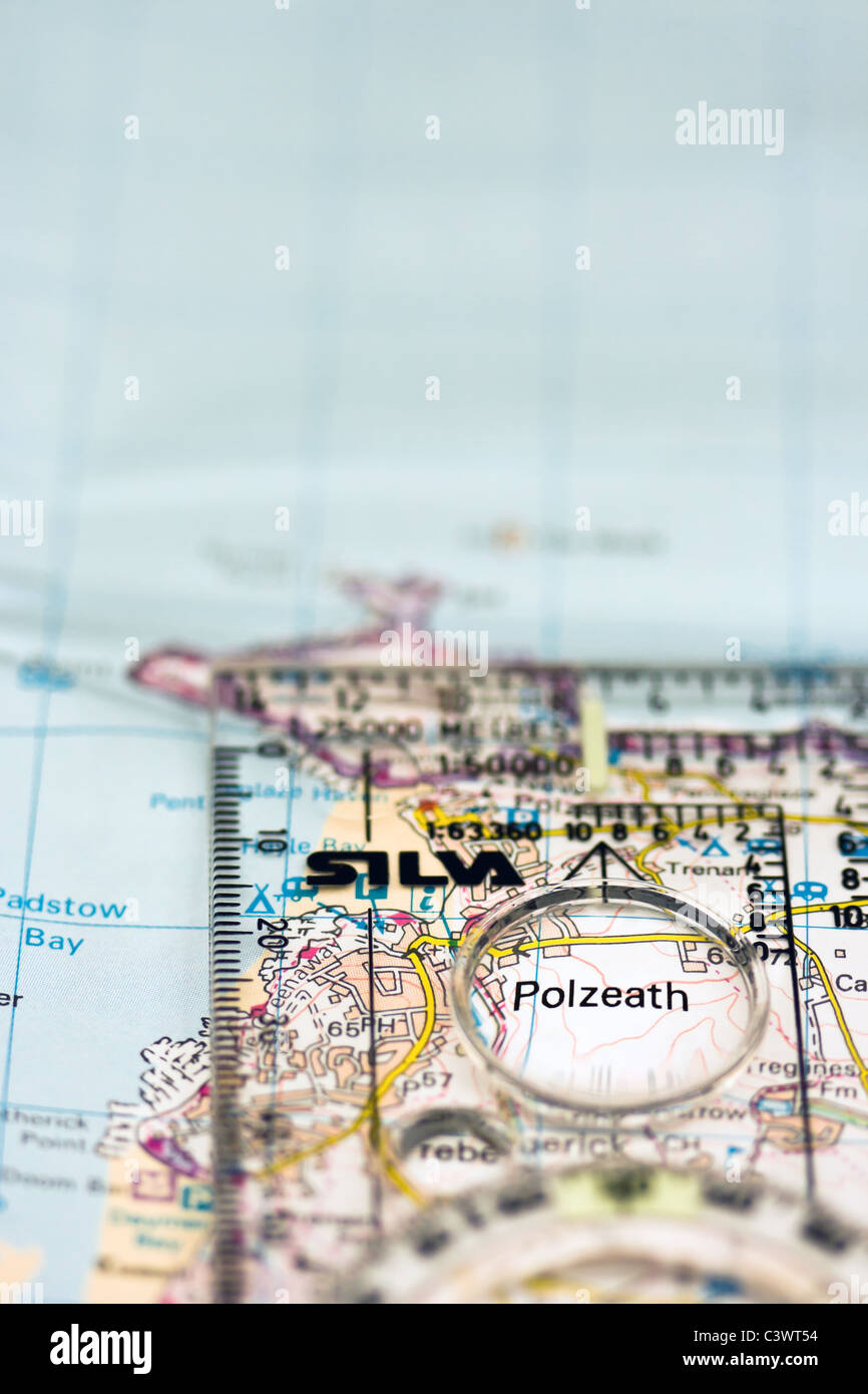 Close up view of a map with a compass magnifying the Cornish resort of Polzeath Stock Photo