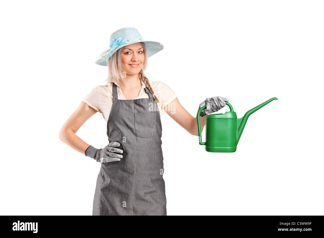 A beautiful female gardener with watering can Stock Photo - Alamy