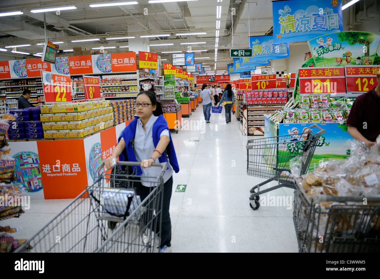 Chinese customers shopping in a WalMart supermarket in Beijing, China