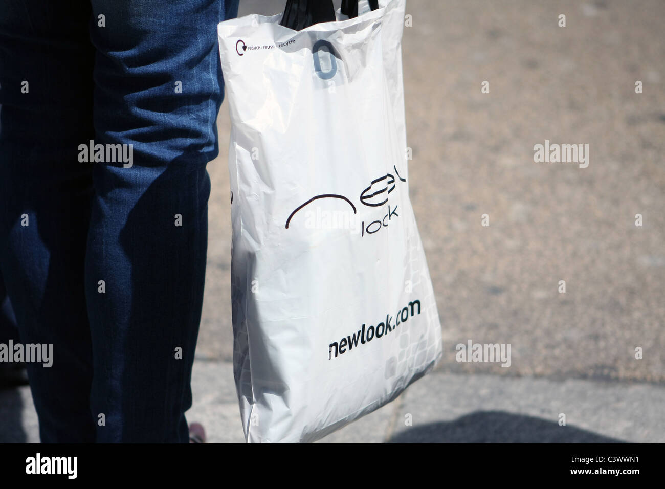 A New Look shopping bag being carried by a person waiting to cross a road  in London Stock Photo - Alamy