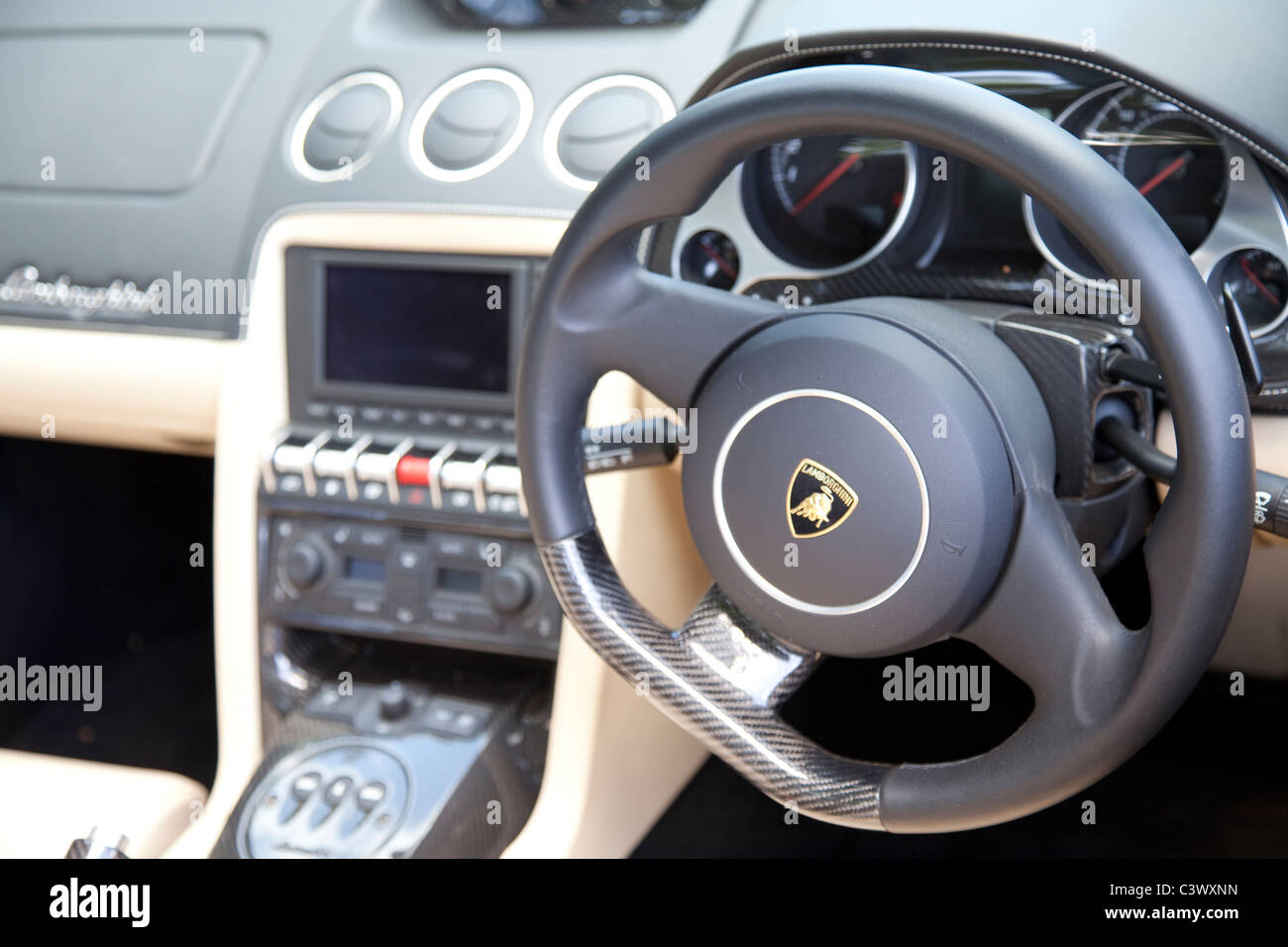 A steering wheel and interior including dashboard inside a Lamborghini  sports car England UK Stock Photo - Alamy
