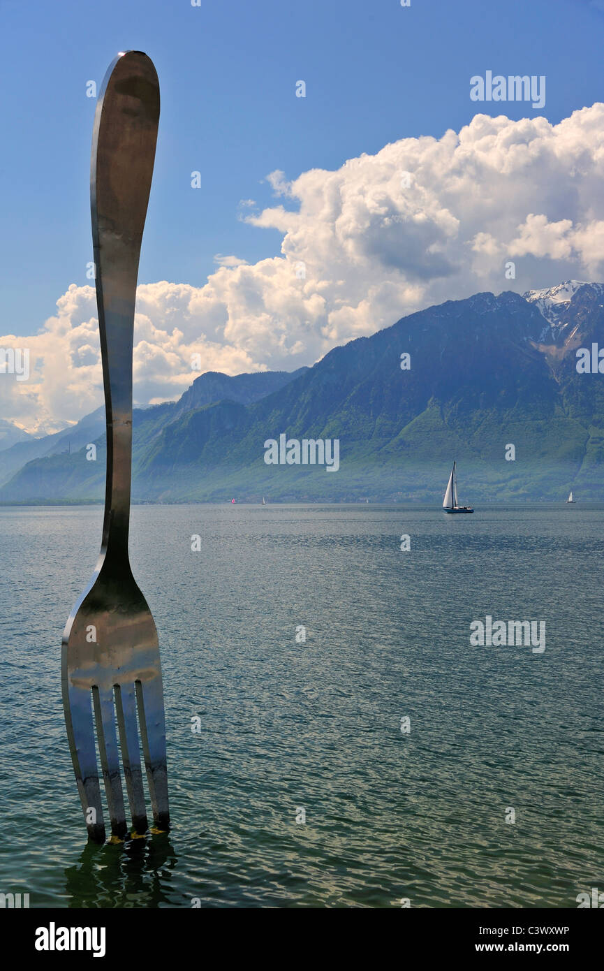 View of Lac Leman at Vevey. The fork sculpture in the lake, outside the Alimentarium museum (Food museum). Stock Photo