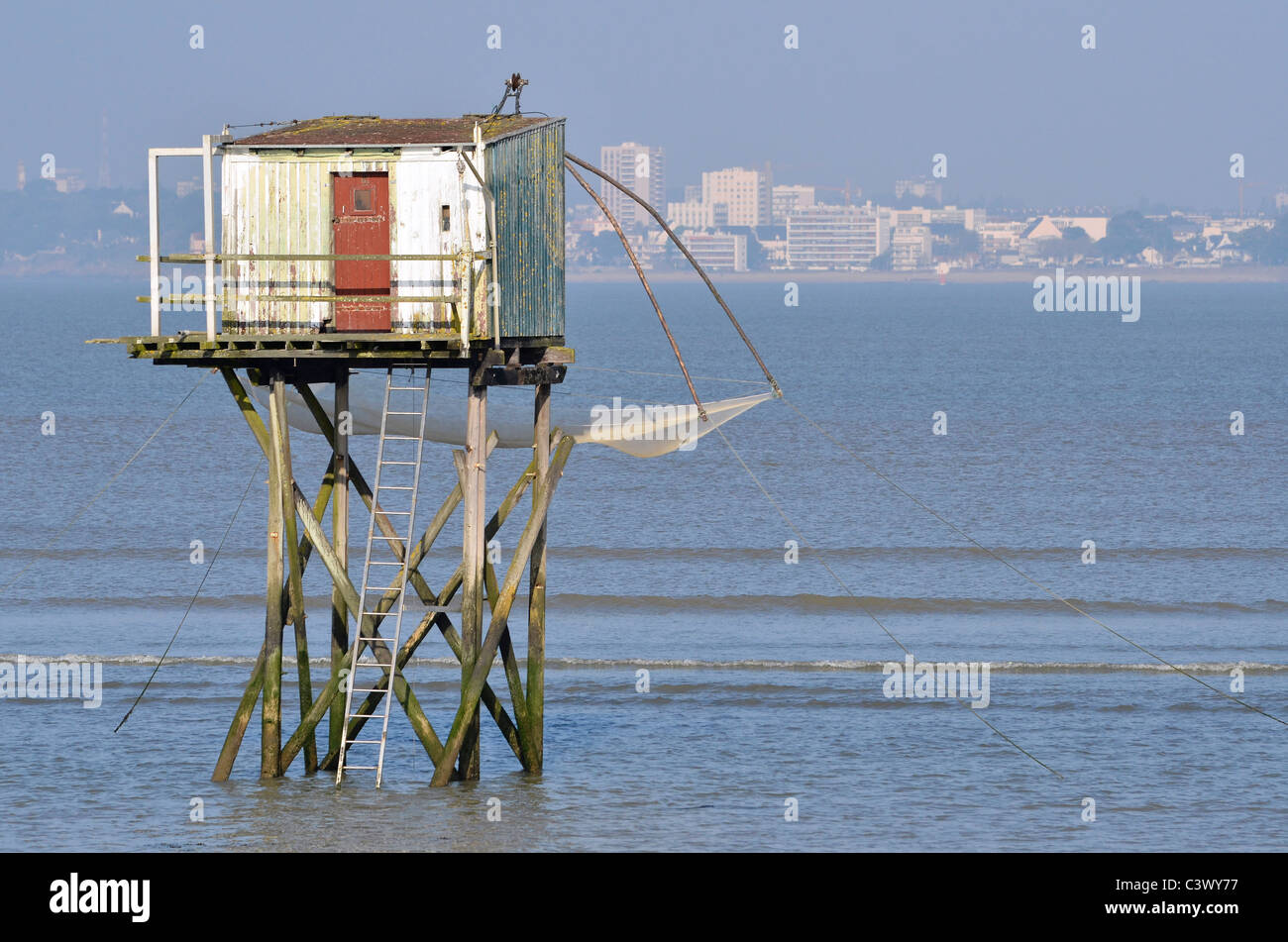 Fishing carrelet from Saint Brevin les Pins and the town of Saint Nazaire in the background in Pays de la Loire region in wester Stock Photo