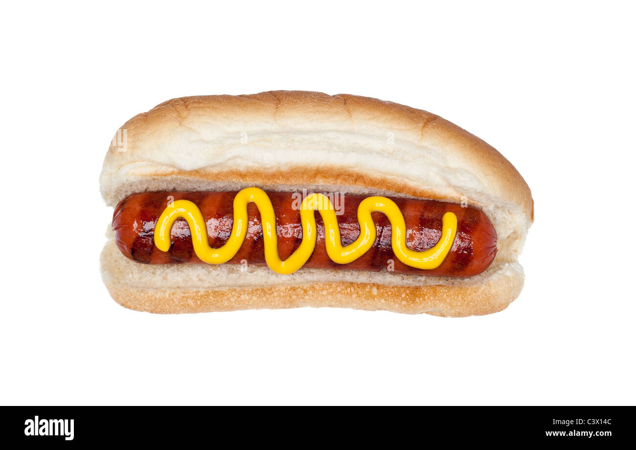 A freshly grilled hotdog on a bun with a stream of mustard isolated on white. Stock Photo