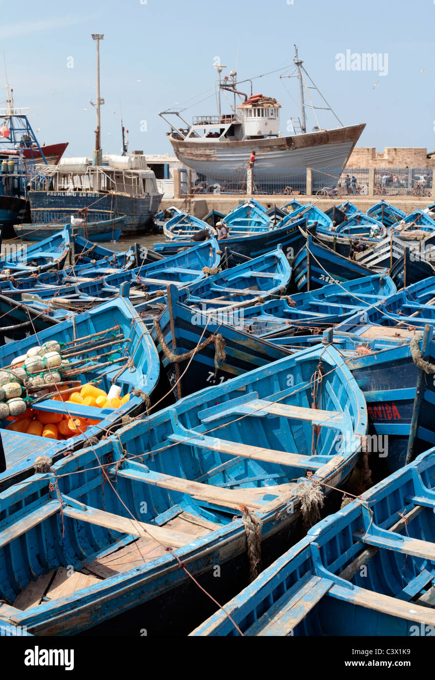 Fishing nets and blue fishing boats in Essaouira Port