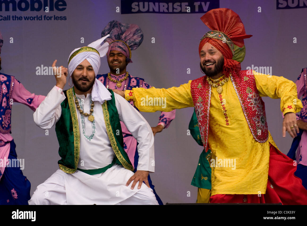 Sikh Indian dancers in traditional dress costume Stock Photo - Alamy