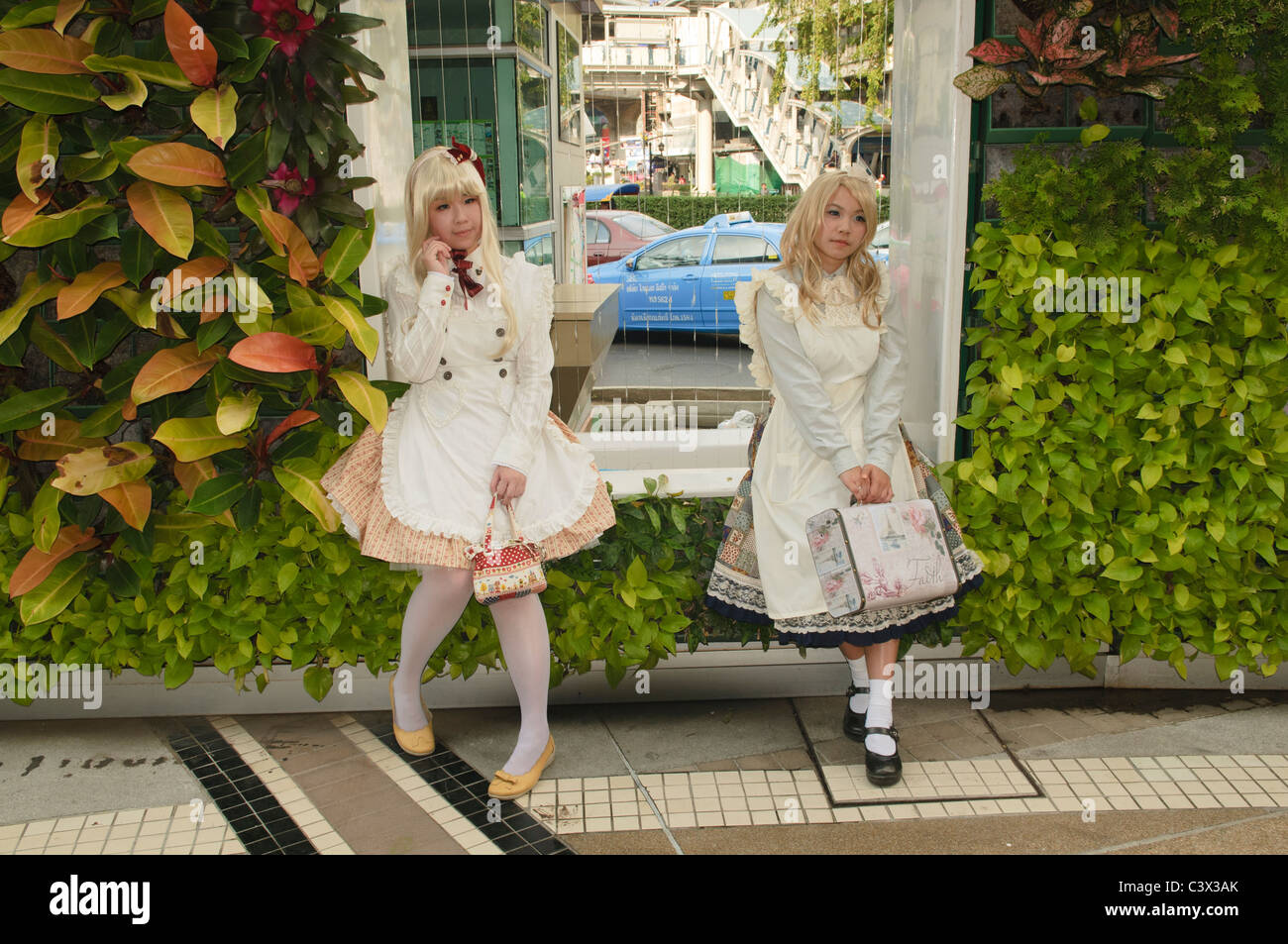 cute young blond Thai girls posing at the Cosplay Festival in Bangkok Stock Photo