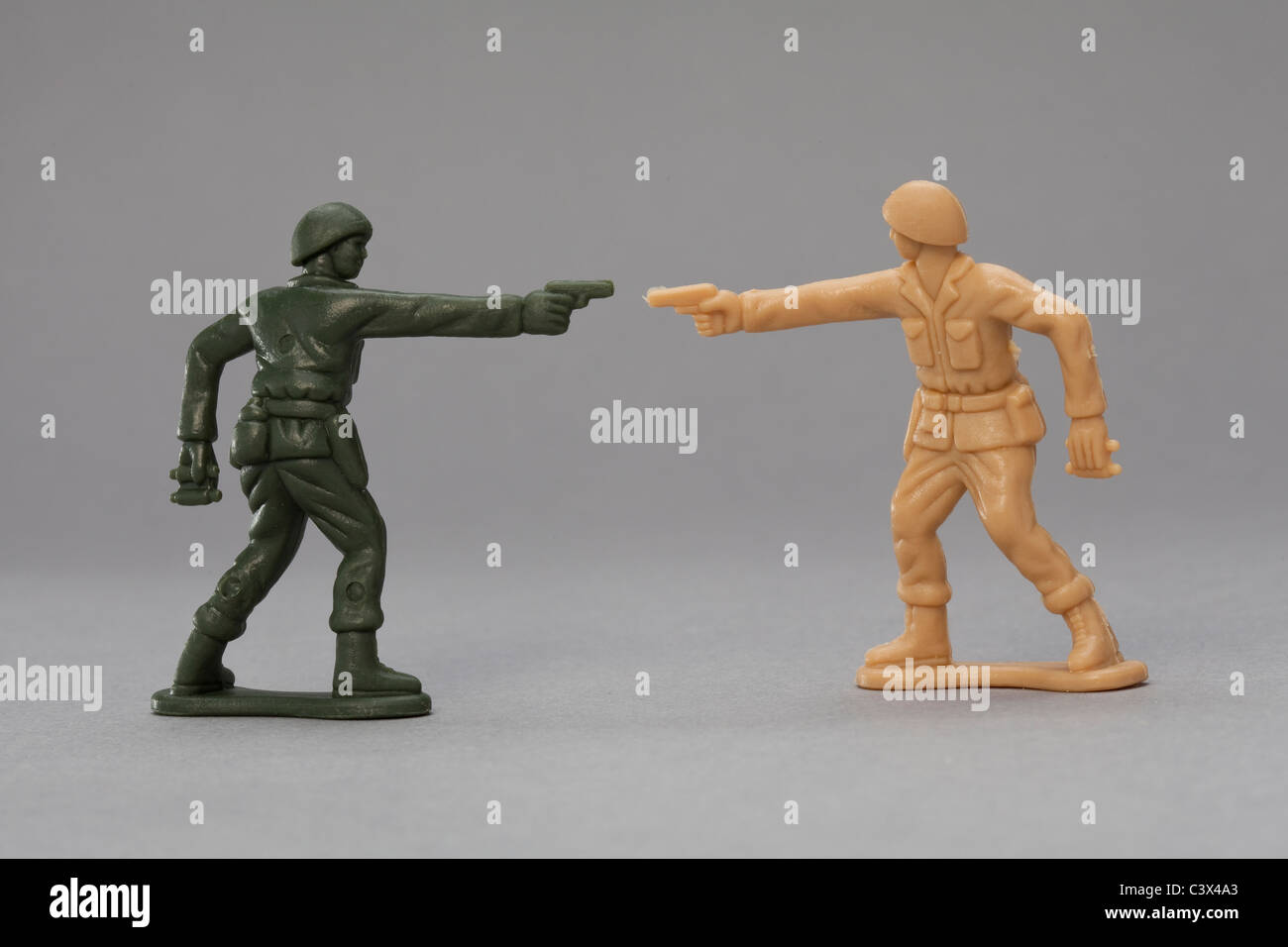 Toy Soldiers firing at each other Stock Photo