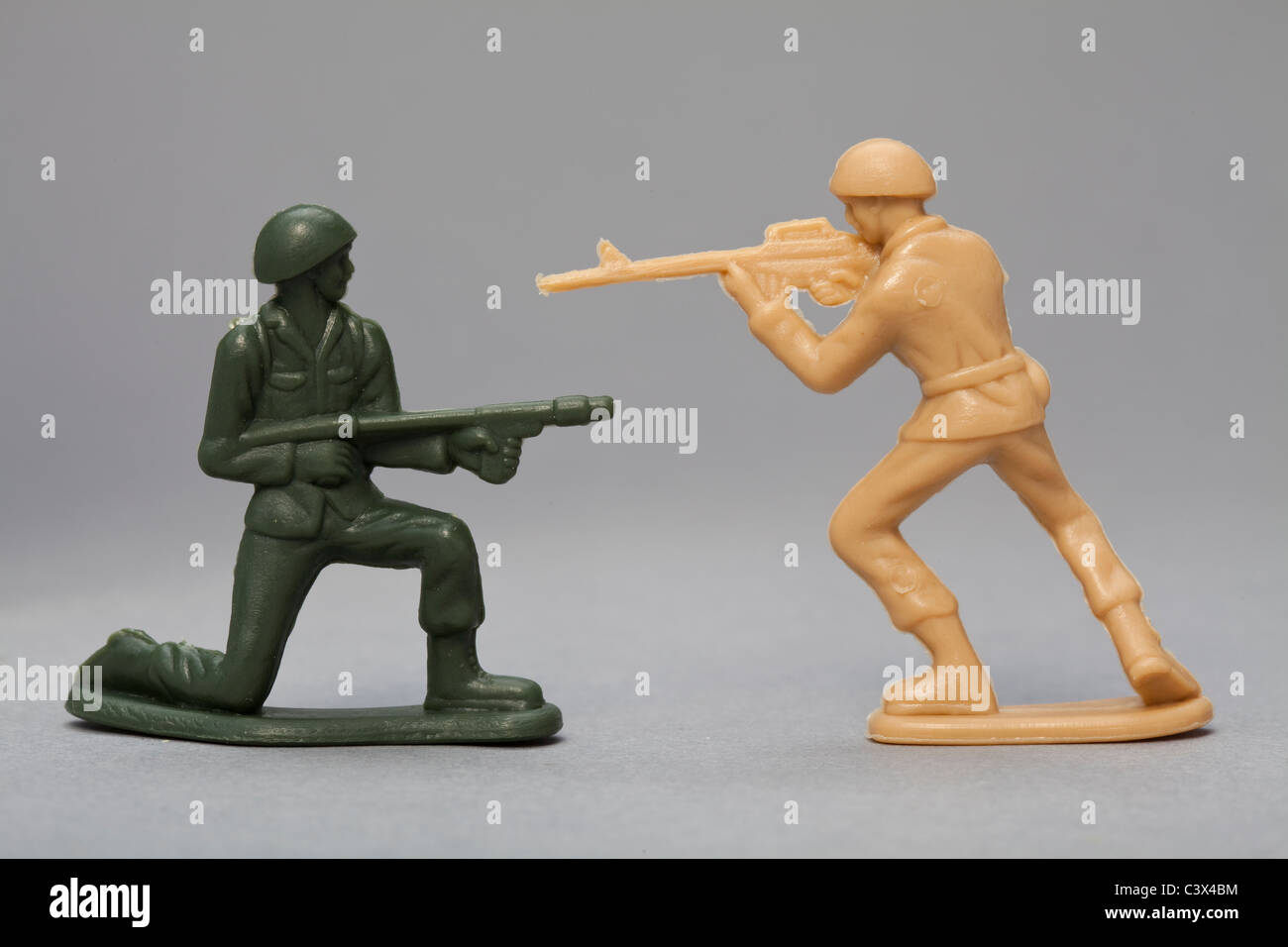 Toy Soldiers firing at each other Stock Photo