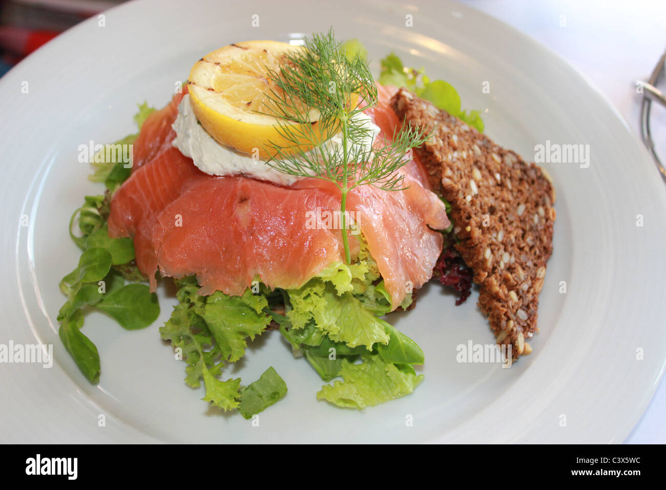 Danish sandwich "smørrebrød" with gravlax (raw spiced salmon) made of