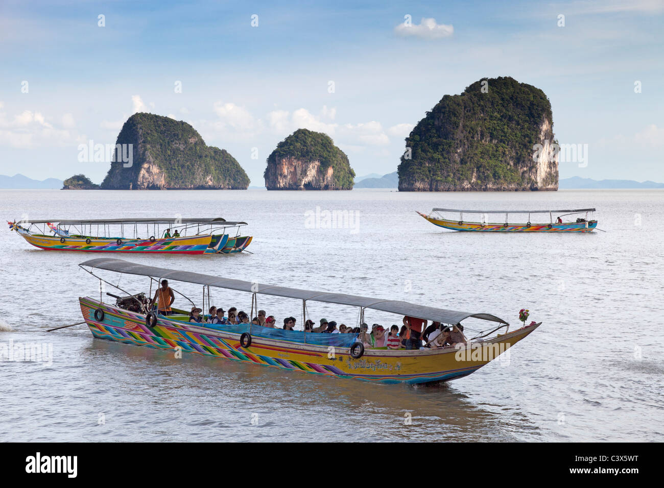 Tourist boats moored off Ko Tapu, Phuket, Thailand - James Bond Island 3 Stock Photo