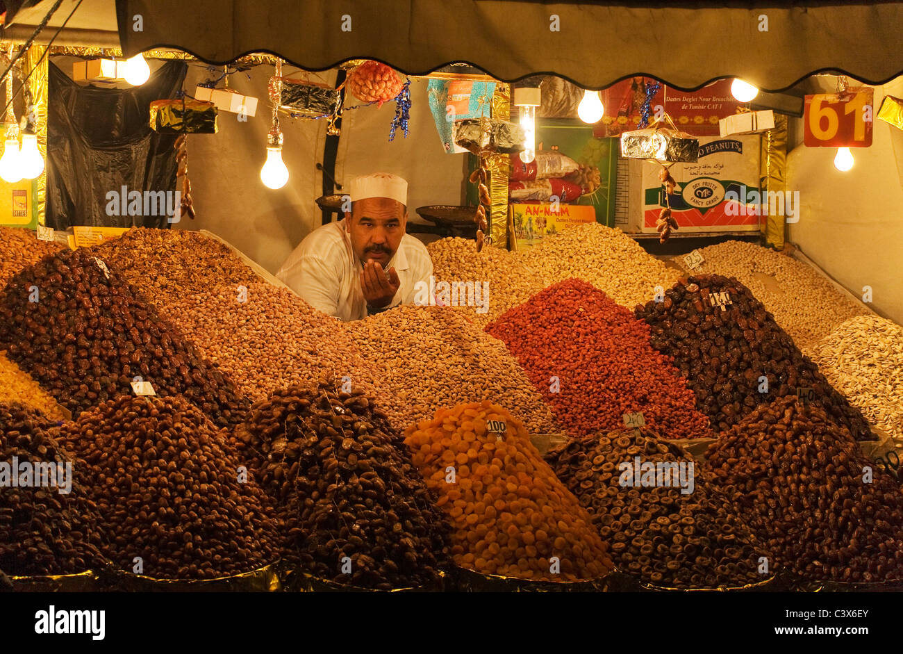Dried fruit and nut vendor on the Djemaa el Fna market place. Marrakesh, Morocco Stock Photo