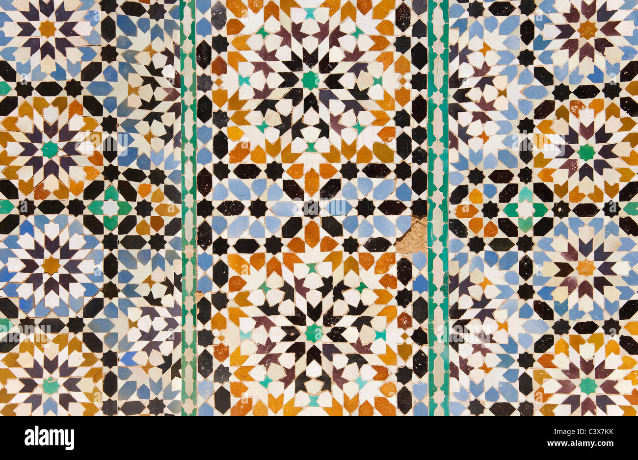 Highly artistic tile works in the central courtyard of the Ben Youssef Medersa, Marrakesh, Morocco. Stock Photo