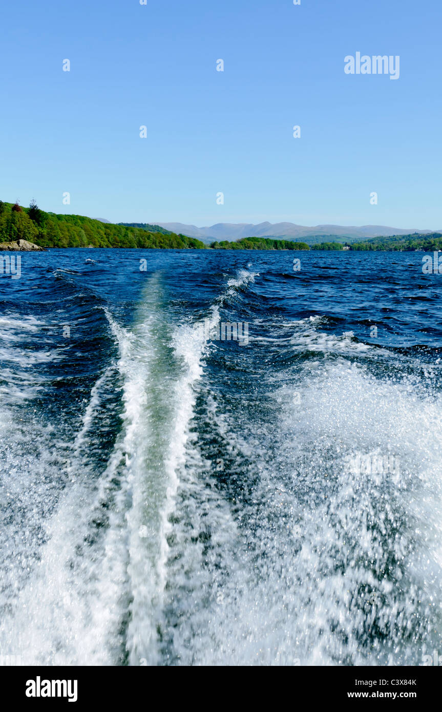 View of Lake Windermere and mountains from speed boat Lake District