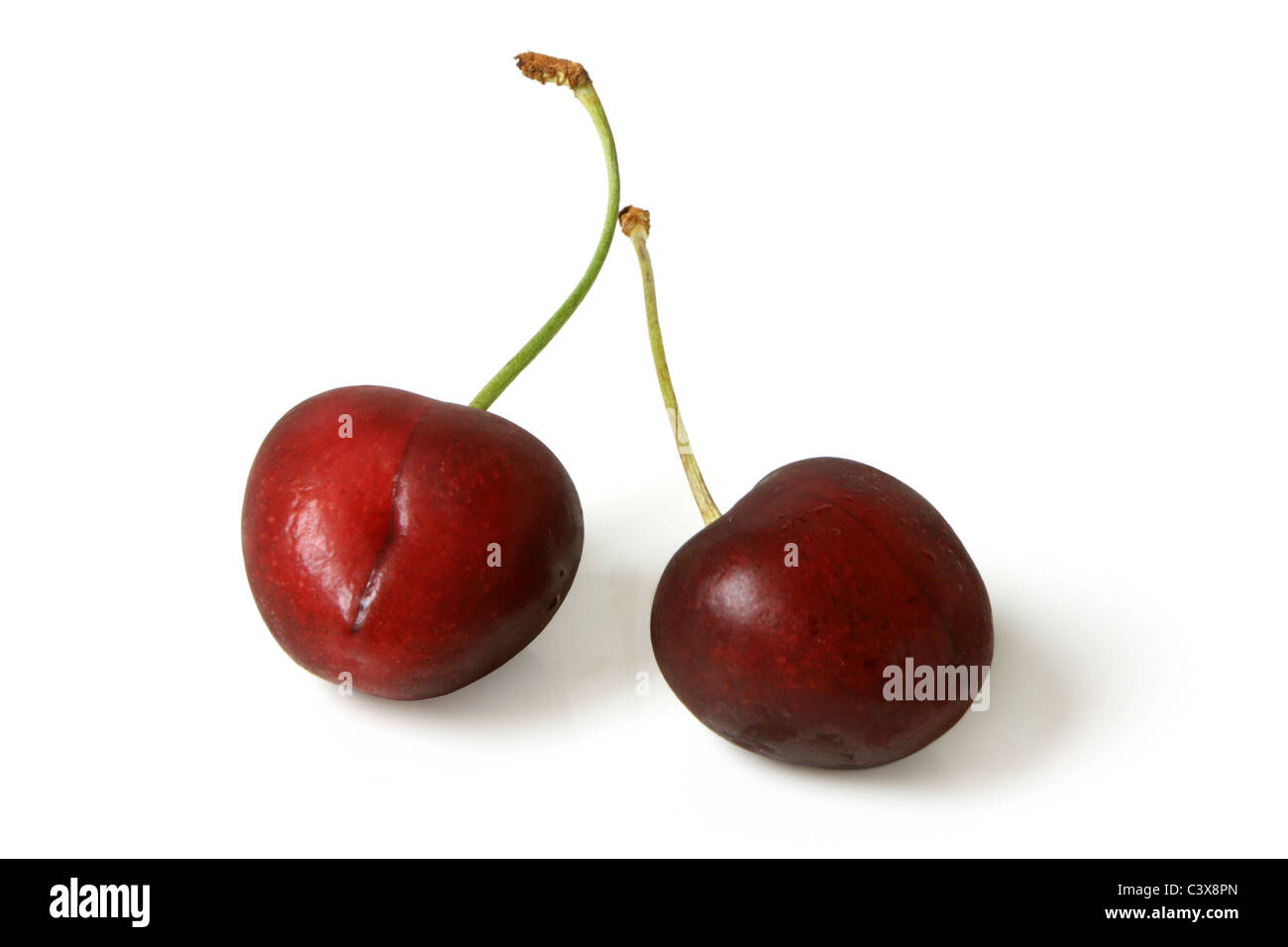 Two red cherries Stock Photo - Alamy