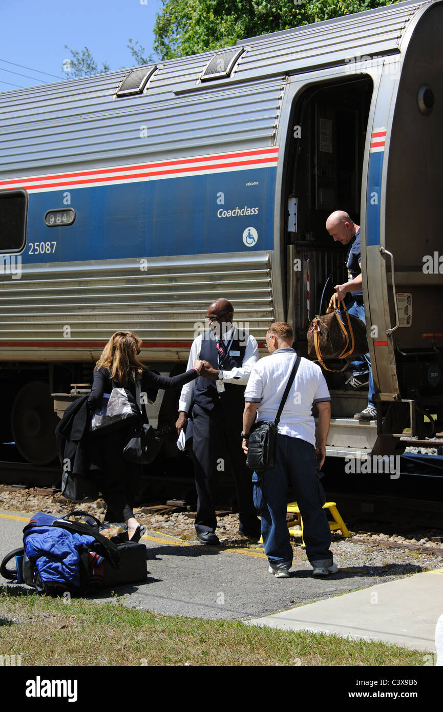 AMTRAK Silver Meteor passenger train arriving at Deland Railroad Station Florida USA passengers alighting from the train Stock Photo