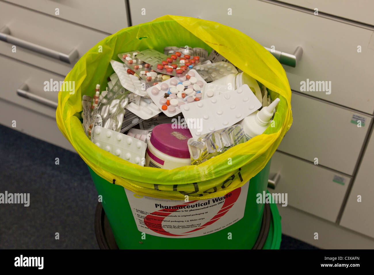 Pharmaceutical drugs for disposal in special DOOP bins after being returned from patients as unwanted or not needed tablets Stock Photo