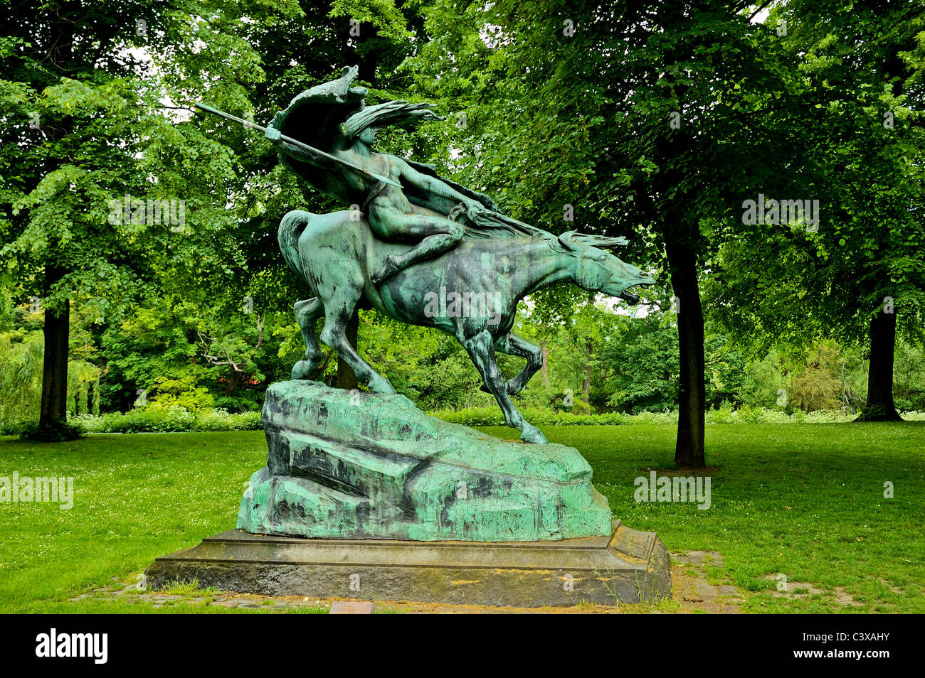 A large bronze statue of a warlike valkyrie riding a horse and carrying a spear, located in Churchill Park, Copenhagen Stock Photo