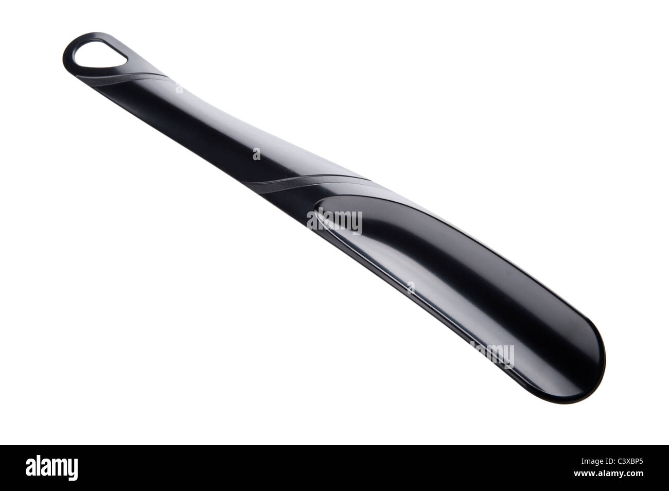 object on white plastic shoehorn close up Stock Photo Alamy