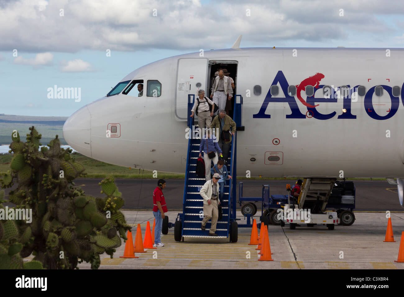 tourists arriving on AeroGal flight at Seymour airport, Baltra Island, Galapagos Islands, Ecuador Stock Photo