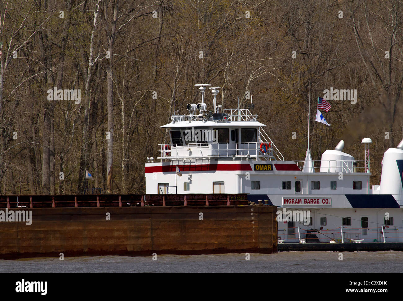 Tugboat M/V Omar pushing a load of barges down the Ohio River between Kentucky and Indiana Stock Photo