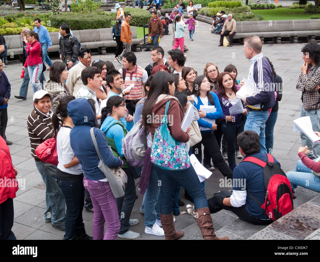students listening to lecturer on steps of cathedral, Plaza Grande, Centro Historico, Quito, Ecuador Stock Photo