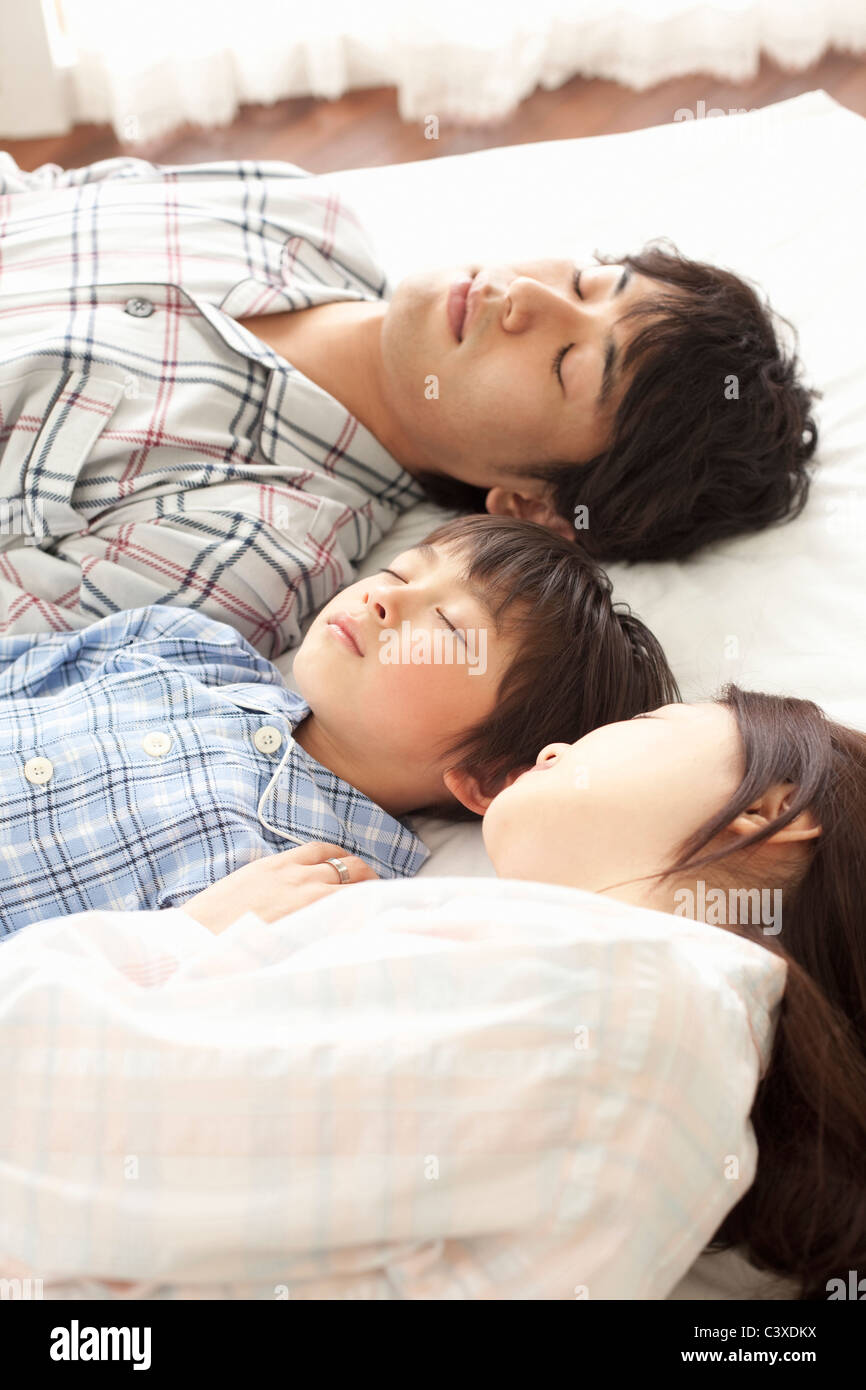 Mother, Father and Son Sleeping Stock Photo - Alamy