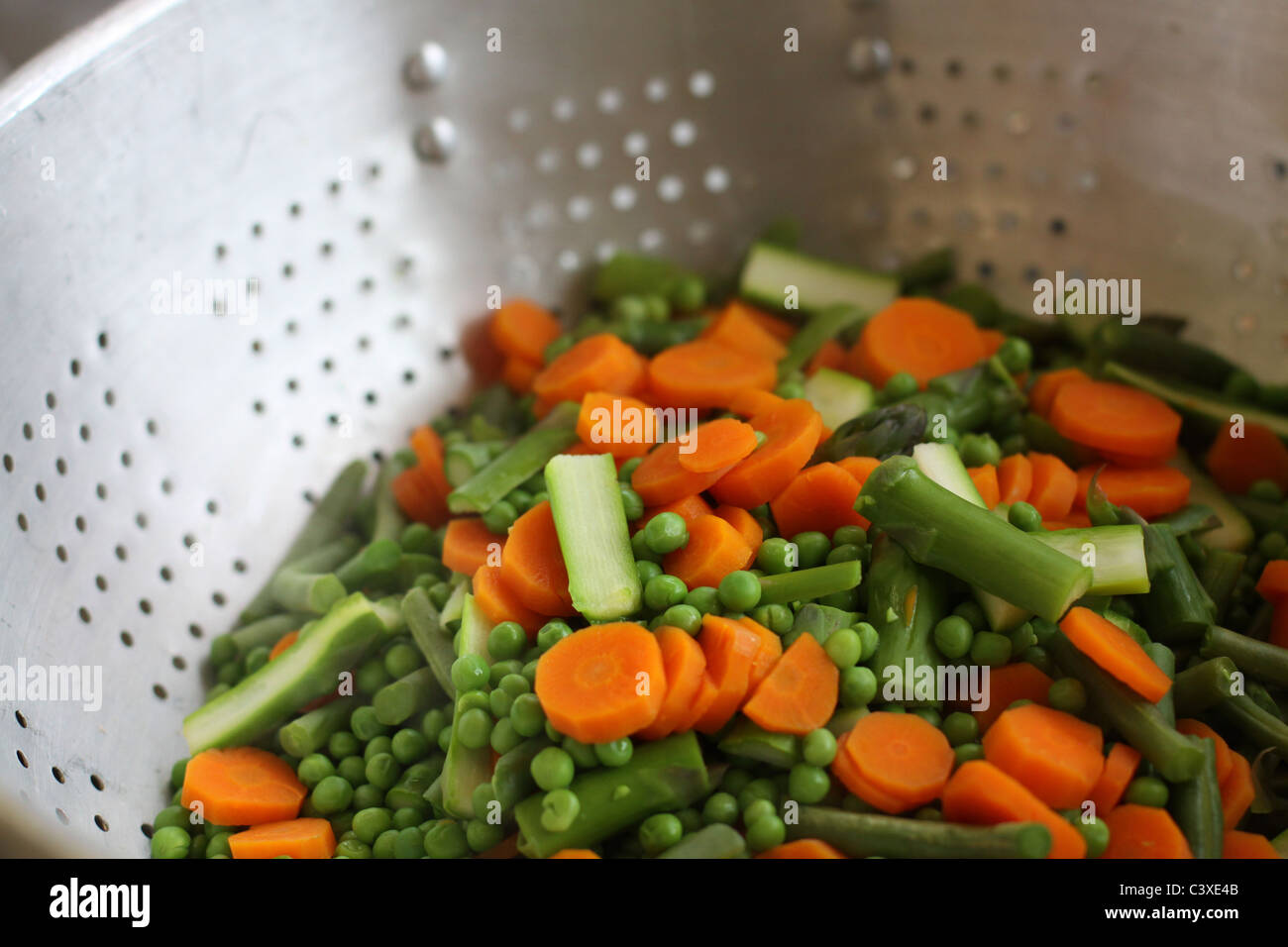 Mixed, steamed vegetables in a colander Stock Photo Alamy