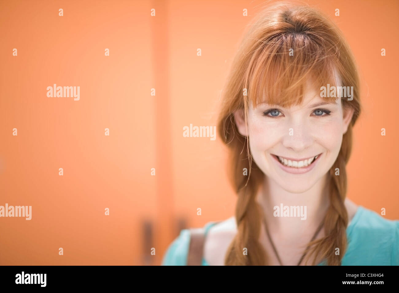 Red haired woman smiling Stock Photo