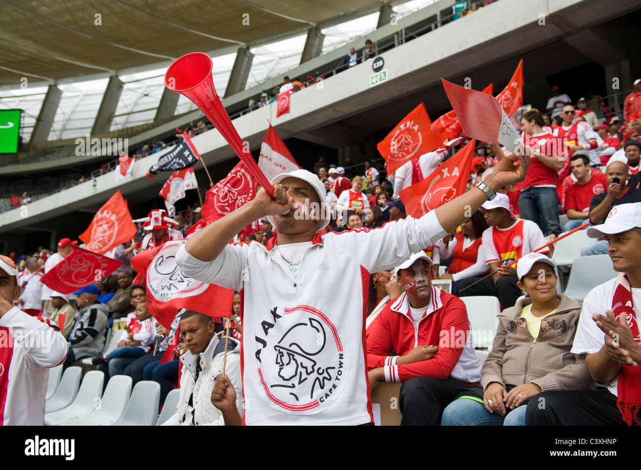 Supporters of Ajax Cape Town Football Club in Cape Town Stadium, Cape Town, Western Cape, South Africa Stock Photo