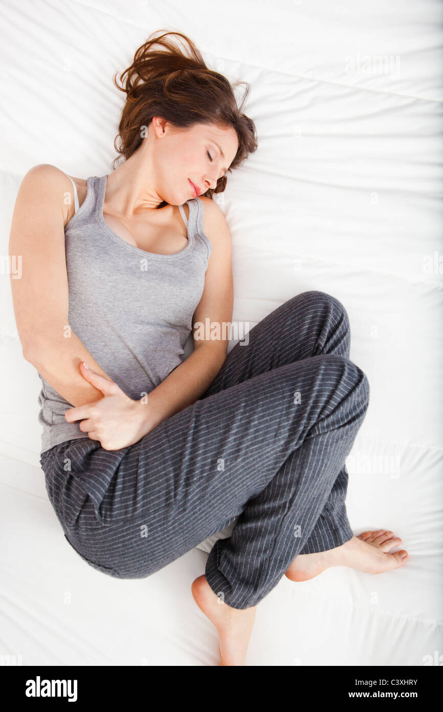 Young girl in pain with PMS, Premenstrual Syndrome Stock Photo