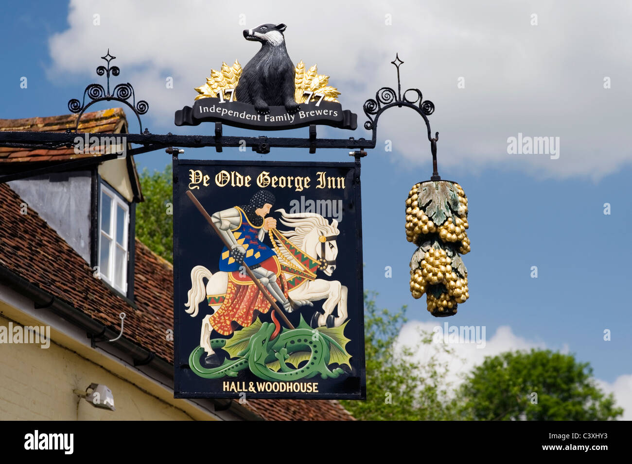ornate traditional pub sign in rural english village Stock Photo